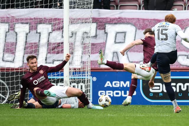 Dundee's Simon Murray scores the only goal of the game against Hearts at Tynecastle. 