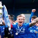Peterhead captain Jason Brown lifts the William Hill League Two trophy following the win over East Fife at Balmoor Stadium/