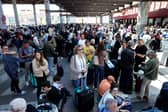 People wait outside the Atocha train station in Madrid after its closure as a massive power outage hits Spain. Picture: Thomas Coex/AFP via Getty Images