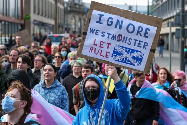 People from the transgender community hold a protest against the Supreme Court ruling on the definition of a woman. Picture:  Jeff J Mitchell/Getty Images