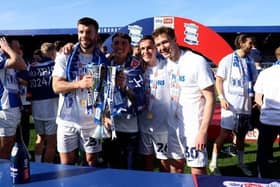 Birmingham City's Grant Hanley, goalkeeper Bradley Mayo, Luke Harris and Kieran Dowell with the Sky Bet League One trophy. Cr: PA.