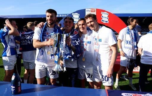 Birmingham City's Grant Hanley, goalkeeper Bradley Mayo, Luke Harris and Kieran Dowell with the Sky Bet League One trophy. Cr: PA.
