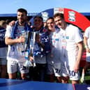 Birmingham City's Grant Hanley, goalkeeper Bradley Mayo, Luke Harris and Kieran Dowell with the Sky Bet League One trophy. Cr: PA.