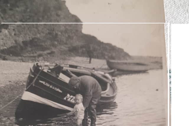 George and his son Brian with the family fishing boat at Bervie Bay. It was later requisitioned by the Ministry of Defence for its engine, according to the family. PIC: Ranson family.