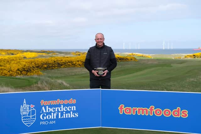 Nick McCarthy shows off the trophy after winning the Aberdeen Golf Links Pro Am at Royal Aberdeen, Cruden Bay and Trump International Golf Links