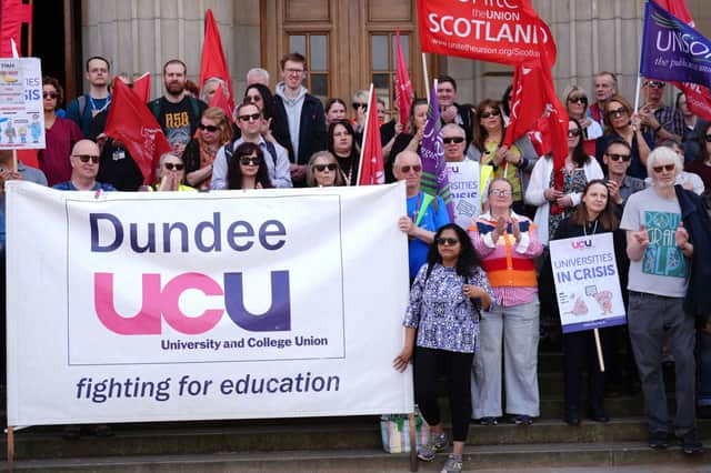 Trade unionists, community activists, students and staff from the University of Dundee take part in a rally and march on Tuesday