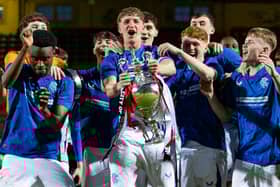 Rangers' Jack Wyllie (c) lifts the Glasgow Cup trophy following the penalty shoot-out victory over Celtic at Firhill. (Photo by Craig Foy / SNS Group)