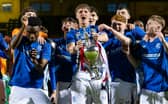 Rangers' Jack Wyllie (c) lifts the Glasgow Cup trophy following the penalty shoot-out victory over Celtic at Firhill. (Photo by Craig Foy / SNS Group)