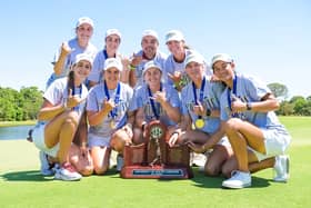Hannah Darling, front centre, celebrates with her University of Carolina team-mates after winning the SEC Championship in Florida