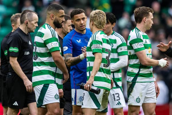 Rangers' James Tavernier (centre) and Celtic's Daizen Maeda shake hands after the most recent Old Firm match.  (Photo by Craig Foy / SNS Group)