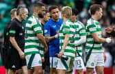 Rangers' James Tavernier (centre) and Celtic's Daizen Maeda shake hands after the most recent Old Firm match.  (Photo by Craig Foy / SNS Group)