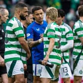 Rangers' James Tavernier (centre) and Celtic's Daizen Maeda shake hands after the most recent Old Firm match.  (Photo by Craig Foy / SNS Group)