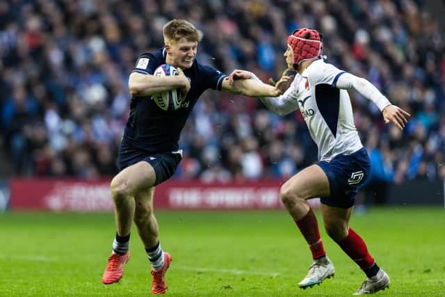 Harry Paterson holds off France's Louis Bielle-Biarrey during his Scotland debut in the 2024 Six Nations clash at Murrayfield. (Photo by Ross MacDonald / SNS Group)