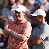 Bob MacIntyre and Rory McIlroy chat after being paired for the first two rounds of the 2024 Genesis Scottish Open at The Renaissance Club