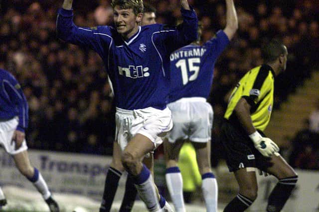 Tore Andre Flo celebrates after netting for Rangers.