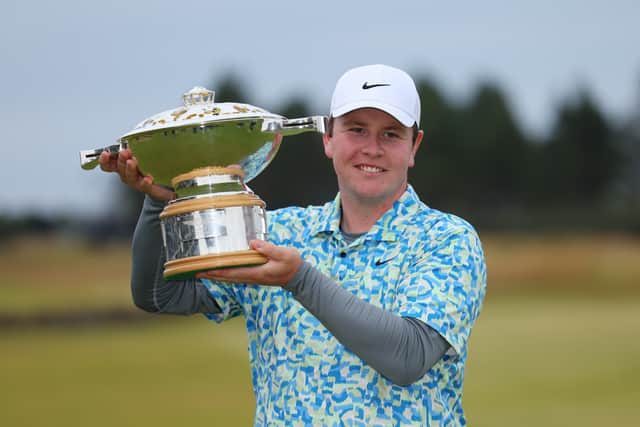 Bob MacIntyre shows off the Genesis Scottish Open trophy after his win in the 2024 edition at  The Renaissance Club 