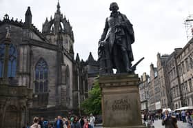 The statue of Adam Smith on Edinburgh's Royal Mile, has his name on the front and the names of the people who funded the statue on the back (Picture: Oli Scarff)