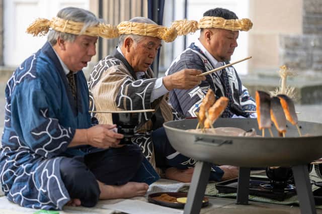 From left, Katsuyoshi Uji, Okawa Masaru and Tetsuya Ogawa during the Ainu repatriation traditional ceremony as the skulls of three indigenous Ainu people were returned to their community by Edinburgh University