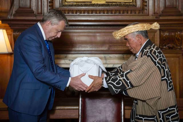 Professor Sir Peter Mathieson of Edinburgh University and Mr Okawa Masaru, executive director of the Ainu Association of Hokkaido, during the ceremony as the skulls of three indigenous Ainu people were returned to their community