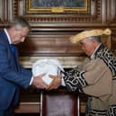 Professor Sir Peter Mathieson of Edinburgh University and Mr Okawa Masaru, executive director of the Ainu Association of Hokkaido, during the ceremony as the skulls of three indigenous Ainu people were returned to their community