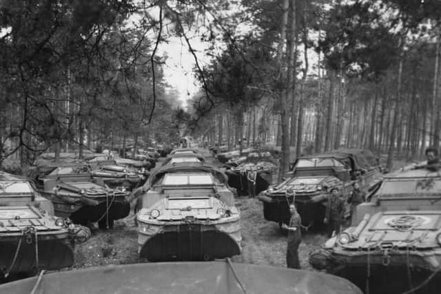 A column of British Army six-wheel-drive amphibious vehicles assembles in a foret clearing ahead of Operation Plunder on March 24, 1945. PIC: Getty.