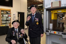 Veterans Richard Pelzer (left), 101, and Ron Horsey, 98, who both served with the Royal Engineers, holding the new VE Day 50p coin at the Royal Mint manufacturing site in South Wales (Photo: The Royal Mint)
