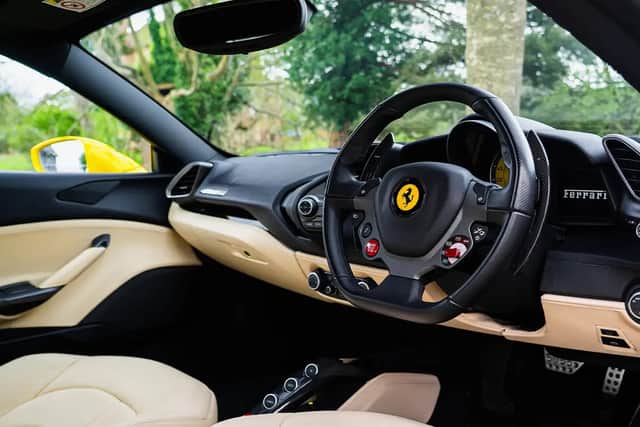 The cream leather interior is a classic choice in a Ferrari