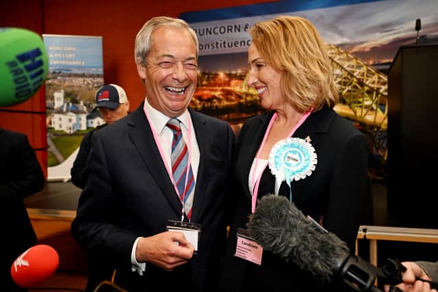 Nigel Farage (left) and Sarah Pochin of the Reform Party speak to members of the media as a vote recount is conducted during the Runcorn and Helsby by-election. Picture: Anthony Devlin/Getty Images