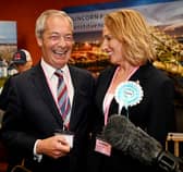 Nigel Farage (left) and Sarah Pochin of the Reform Party speak to members of the media as a vote recount is conducted during the Runcorn and Helsby by-election. Picture: Anthony Devlin/Getty Images