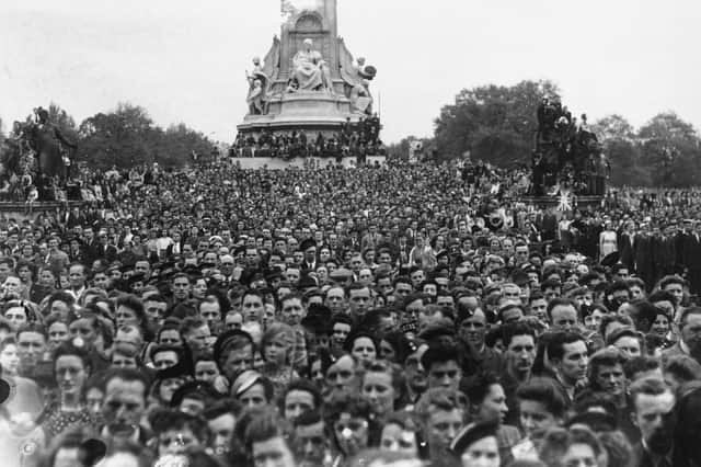 The crowd gathered to celebrate VE Day at the end of the end of World War Two at Buckingham Palace on May 8, 1945.
