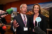 RUNCORN, ENGLAND - MAY 02: Nigel Farage (L) and Sarah Pochin of the Reform Party speak to members of the media as a vote recount is conducted during the Runcorn and Helsby by-election at the DCBL Stadium on May 2, 2025 in Runcorn, England. The Runcorn and Helsby seat is in contention after MP Mike Amesbury was prosecuted for a drunken assault on a constituent. Once one of Labour's safest seats with a 14696-vote majority, Nigel Farage's Reform Party is polling well. (Photo by Anthony Devlin/Getty Images)