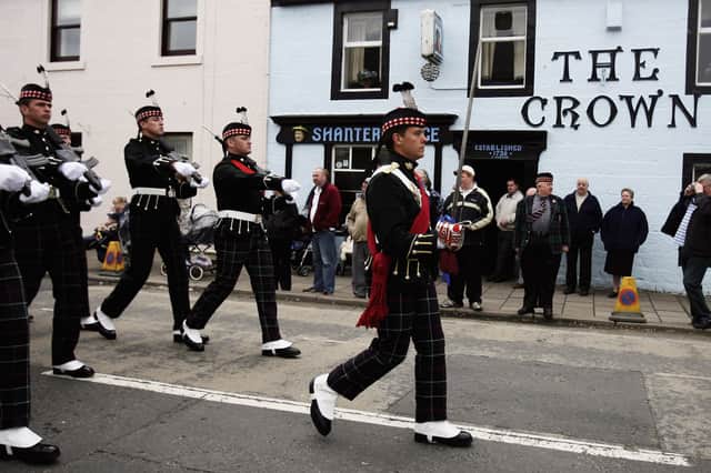 The King's Own Scottish Borderers stage a parade in Sanquhar May 25,2006 before the historic regiment was disbanded and merged with the Royal Scots. PIC: Getty.
