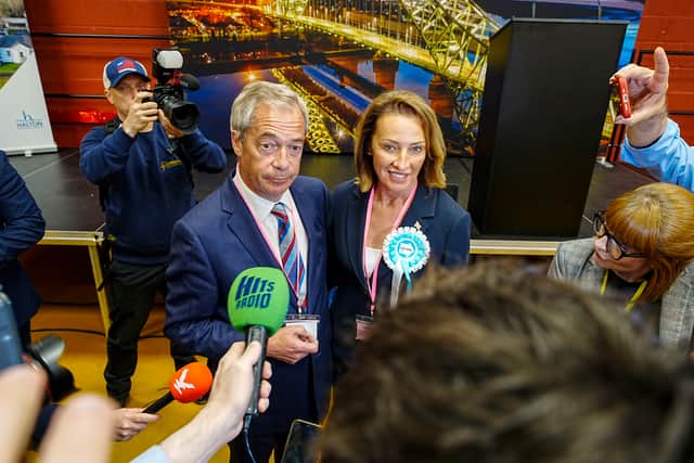 Reform UK's candidate Sarah Pochin (right) and party leader Nigel Farage speak to the media as they arrive ahead of the result of the Runcorn and Helsby by-election. Picture: Peter Byrne/PA Wire