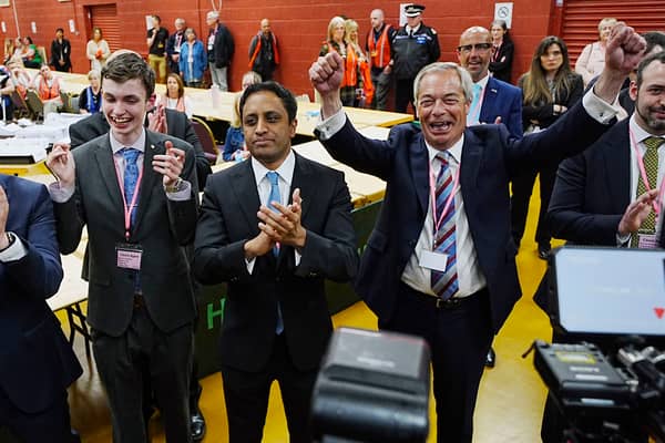 Reform UK leader Nigel Farage (right) and chair Zia Yusuf (centre) celebrate for the media after Reform candidate Sarah Pochin won the Runcorn and Helsby by-election in Widnes, Cheshire. Picture: Peter Byrne/PA Wire