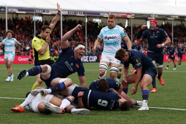 Ben Muncaster celebrates wildly after his Edinburgh team-mate Ali Price (No 9) had given his team hope with their third try.