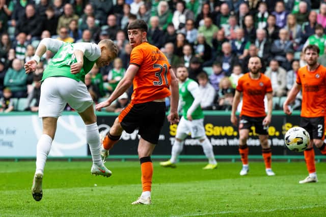 Hibs substitute Dwight Gayle heads home in the 87th minute to seal a 3-1 win over Dundee United. (Photo by Paul Byars / SNS Group)