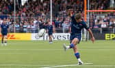 Edinburgh's Ross Thompson kicks a conversion during the Bath match.