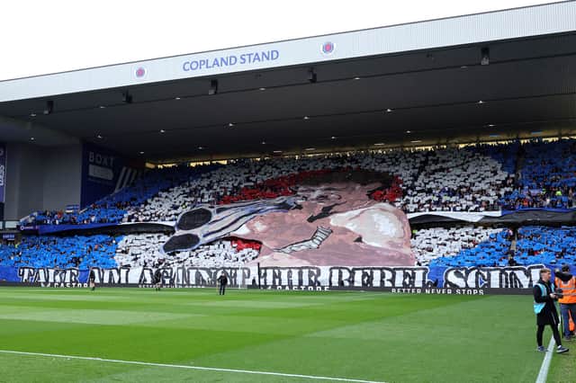 A large banner of an illustration of Rangers former manager and player Graeme Souness aiming a shotgun and the text 'Take aim against the rebel scum' before the William Hill Premiership Old Firm clash with Celtic at Ibrox Stadium in Glasgow
