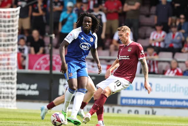 Johnly Yfeko (left) in action for Exeter City against Northampton Town on August 17, 2024. (Photo by Pete Norton/Getty Images)