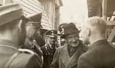 Bill de Ropp questions a Nazi printer in Austria in 1938 as Alfred Rosenberg, left, and two SS officers look on