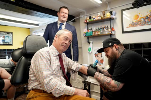 Nigel Farage, seen visiting a tattoo parlour while campaigning in Cambridgeshire ahead of the recent local elections, has made clear he wants to destroy the Conservative party (Picture:  Joe Giddens)