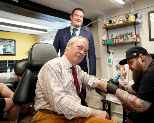 Nigel Farage, seen visiting a tattoo parlour while campaigning in Cambridgeshire ahead of the recent local elections, has made clear he wants to destroy the Conservative party (Picture:  Joe Giddens)