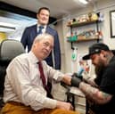 Nigel Farage, seen visiting a tattoo parlour while campaigning in Cambridgeshire ahead of the recent local elections, has made clear he wants to destroy the Conservative party (Picture:  Joe Giddens)