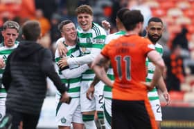 Celtic's Callum McGregor and Arne Engels celebrate their Scottish Premiership title win at Dundee United. Cr: SNS Group.