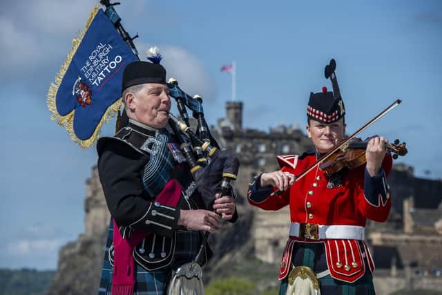 Major Stevie Small, MBE, Tattoo associate director and Corporal Tegan Moisenko from the Band of the Royal Regiment of Scotland at the launch of The Royal Edinburgh Military Tattoo 75th anniversary show, to take place this August.
