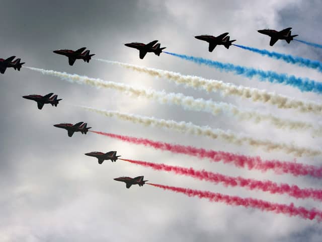 Royal Air Force (RAF) aircraft the Red Arrows complete a flypast. Picture: Matt Cardy/Getty Images