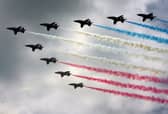 Royal Air Force (RAF) aircraft the Red Arrows complete a flypast. Picture: Matt Cardy/Getty Images
