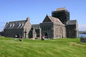 Iona Abbey, Argyll and Bute, Scotland. In 563, St Columba arrived from Ireland and established a monastery on the island, embarking on his mission to convert pagan Scotland and northern England to Christianity. The monastery was abandoned after frequent Viking raids, but a Benedictine Abbey was established in the 1200s. The Protestant Reformation in Scotland saw the abbey closed in the 16th century, but the Church of Scotland began to rebuild it in the 1870s and the Iona Community was established in 1938.