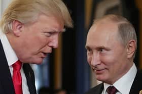 Donald Trump, pictured with Vladimir Putin in 2017, has been pressuring Ukraine to give up territory seized by Russian forces (Picture: Mikhail Klimentyev)
