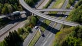 An HGV lorry is seen on its side after crashing through a barrier and falling from abridge on the M90 near Perth. Picture: Katielee Arrowsmith/SWNS